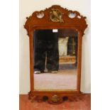 George III style mahogany and parcel gilt fretwork wall mirror inset with an eagle motif and shell