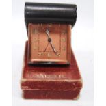 Art Deco Jaeger travel alarm desk clock with Arabic numerals, in a tooled case, 8cm high, with