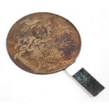 Japanese brass fan, the circular fan decorated with impressed cranes in foliage, bearing character