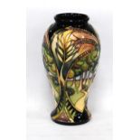 Moorcroft vase designed by Sian Leeper decorated with tube-lined flying birds and poplar trees on
