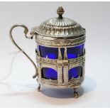 Dutch 19th century silver mustard pot, pierced and embossed with figures and carriages upon a