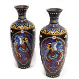 Pair of late 19th/early 20th century oriental cloisonné vases decorated with a central panel of