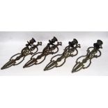 Set of four verdigris bronze wall sconces, each  with a singular sconce with pierced lattice