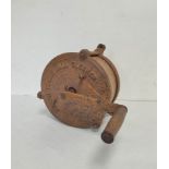 Antique scarce rotor tennis ball cleaner of cast iron construction and wooden crank handle.