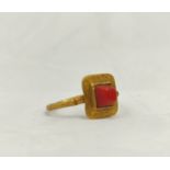 Roman- High carat yellow gold ring with large central table cut carnelian. 4.9g