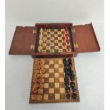 Two antique travel chess sets in wooden cases. One being a Victorian example with bone and wood