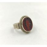 Roman style silver intaglio ring with central agate or carnelian engraved with an imperial eagle
