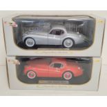 Two Signature Models 1:18 scale boxed die cast model vehicles. To include a 1949 Jaguar XK120 in