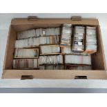 Box containing a large collection of world postage stamps from the estate of a local collector.