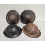 Four British WW2 brodie helmets all lacking liners (4)