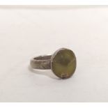 Post Medieval silver ring with unknown collet set central green stone possibly Goa stone.