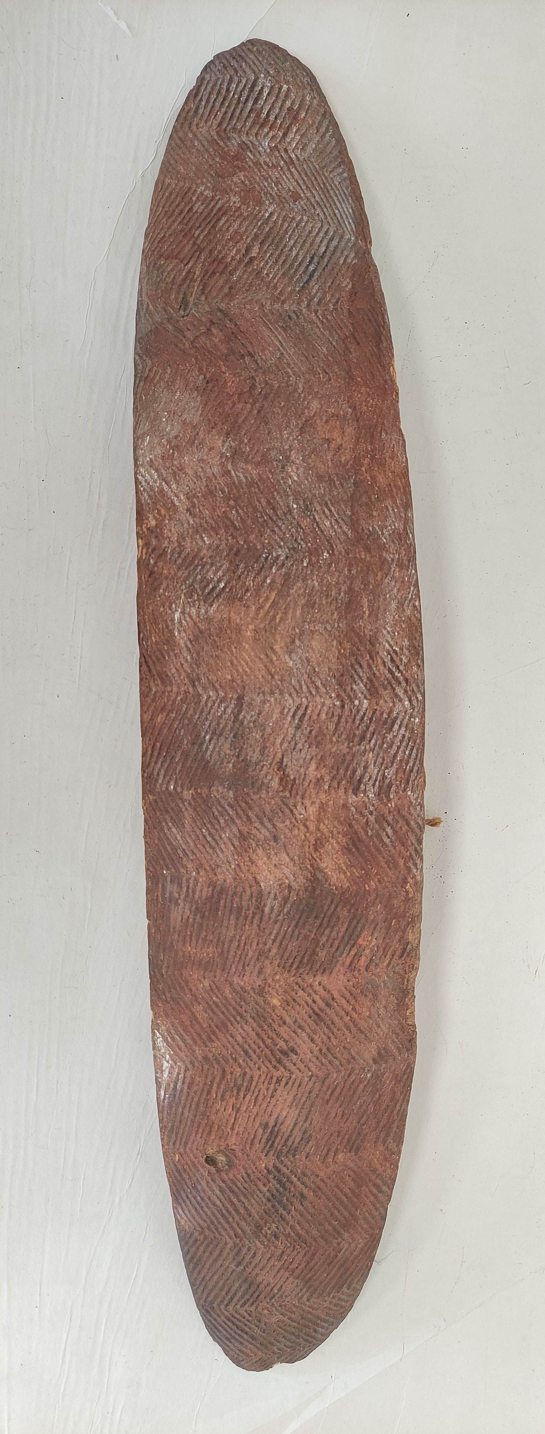 Antique Australian aboriginal wooden Churinga shield of elongated ovoid form and decorated profusely