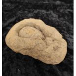 Ancient middle eastern sandstone oil lamp mold with deep incised recess.