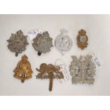 Collection of military cap badges dating from WW1-WW2 to include Tyneside Scottish, Kings Own