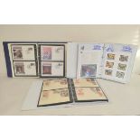 Three well filled world postage stamp albums, mostly comprising of commemorative issues. To