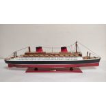 Wooden painted model ship of the SS France. Approximately 81cms in length.
