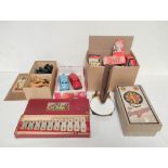 Collection of vintage 1950s toys to include two die-cast friction cars, quantity of doll's house