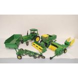 Five vintage ERTL USA die-cast John Deere agricultural toys to include a Combine Harvester,