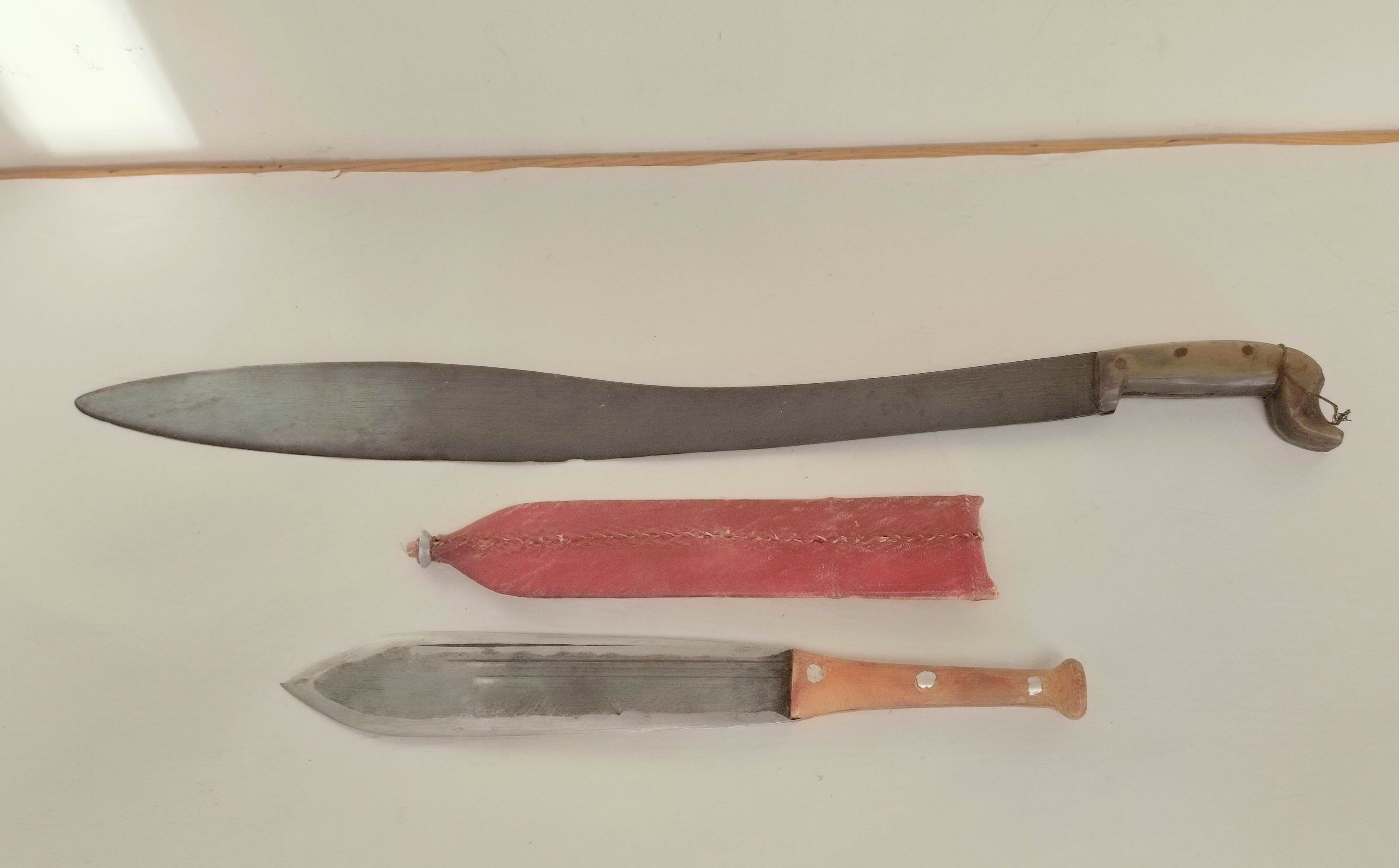 Two tribal edged knifes to include a machete with horn grip from Ayutla Mexico & an African Maasai