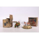 US Zone Germany tinplate clockwork model of a peacock in the manner of Blomer & Schuler boxed and an