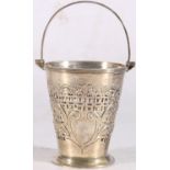 Victorian sterling silver swing-handled bucket, the pierced body with heavy foliate decoration,