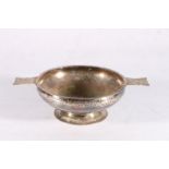 George V sterling silver twin handled bowl, the hammered body flanked by Fox and foliate decorated