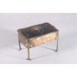Sterling silver bijouterie casket, with inlaid tortoiseshell cover, raised on straight leg supports,
