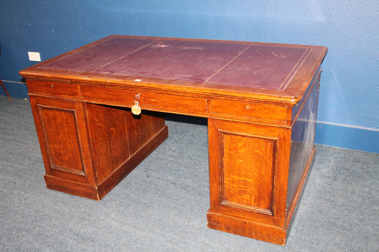 Late Victorian oak partners desk, with a later tooled skiver above a long drawer flanked with a