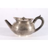 George III sterling silver teapot with fluted body, no makers mark, London, 1801, 14cm tall, 596g.