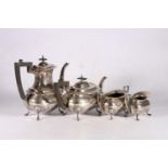 George V sterling silver four piece tea service, with wavy edge rim, on cabriole pad supports,