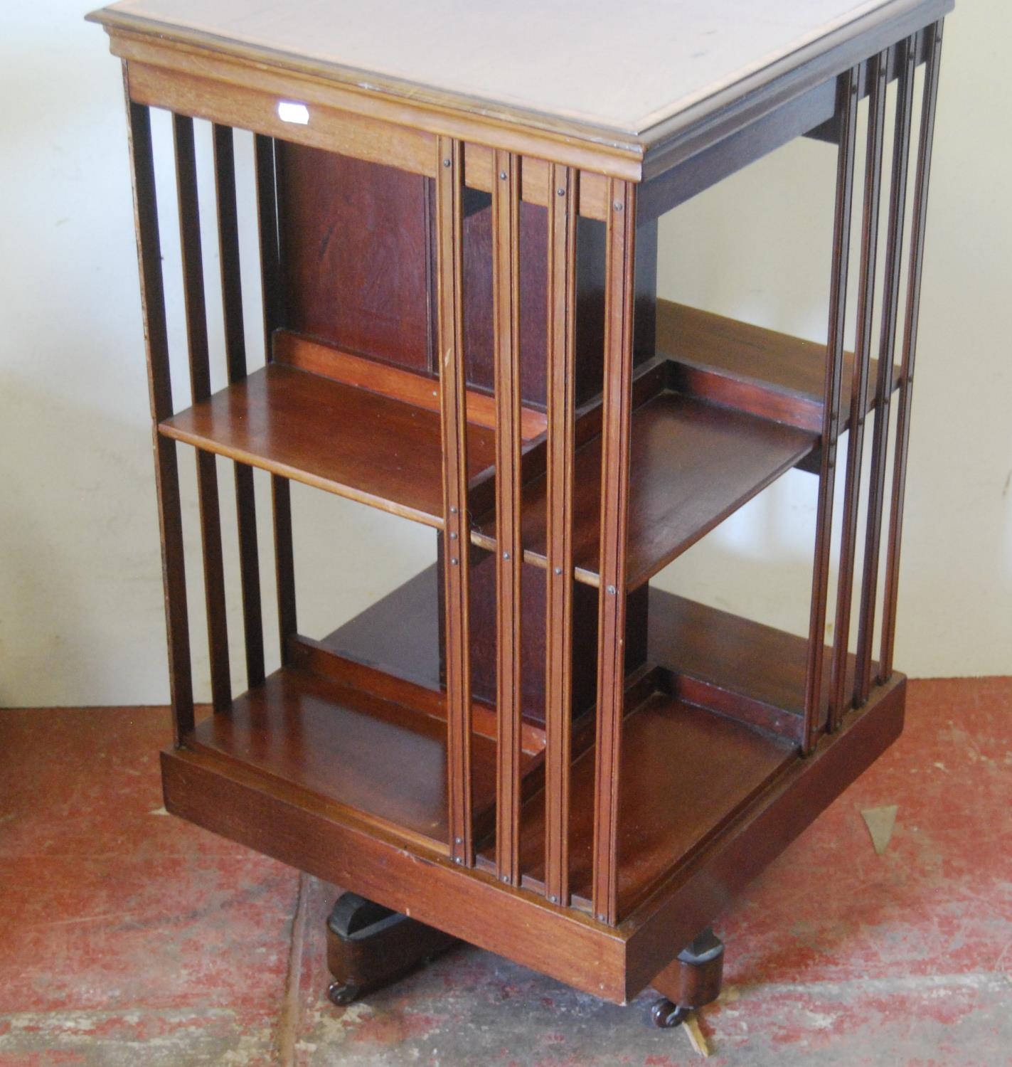 Edwardian inlaid mahogany revolving bookcase, with open shelving and three short drawers to the - Image 4 of 5