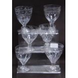 Group of Regency-style antique rummers and drinking glasses, all with etched decoration, on