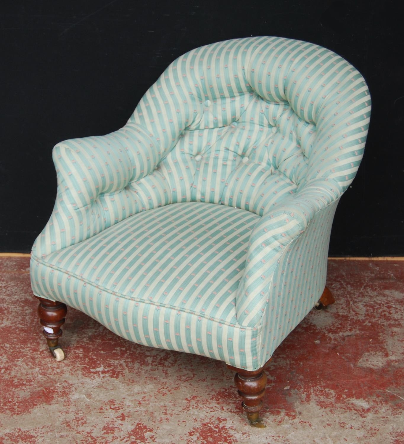 19th century walnut lady's armchair, upholstered in later striped button-back fabric, on brass