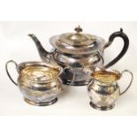 Silver three-piece tea set of oval baluster form, initialled 'M', by Harry Atkin for Cameron,