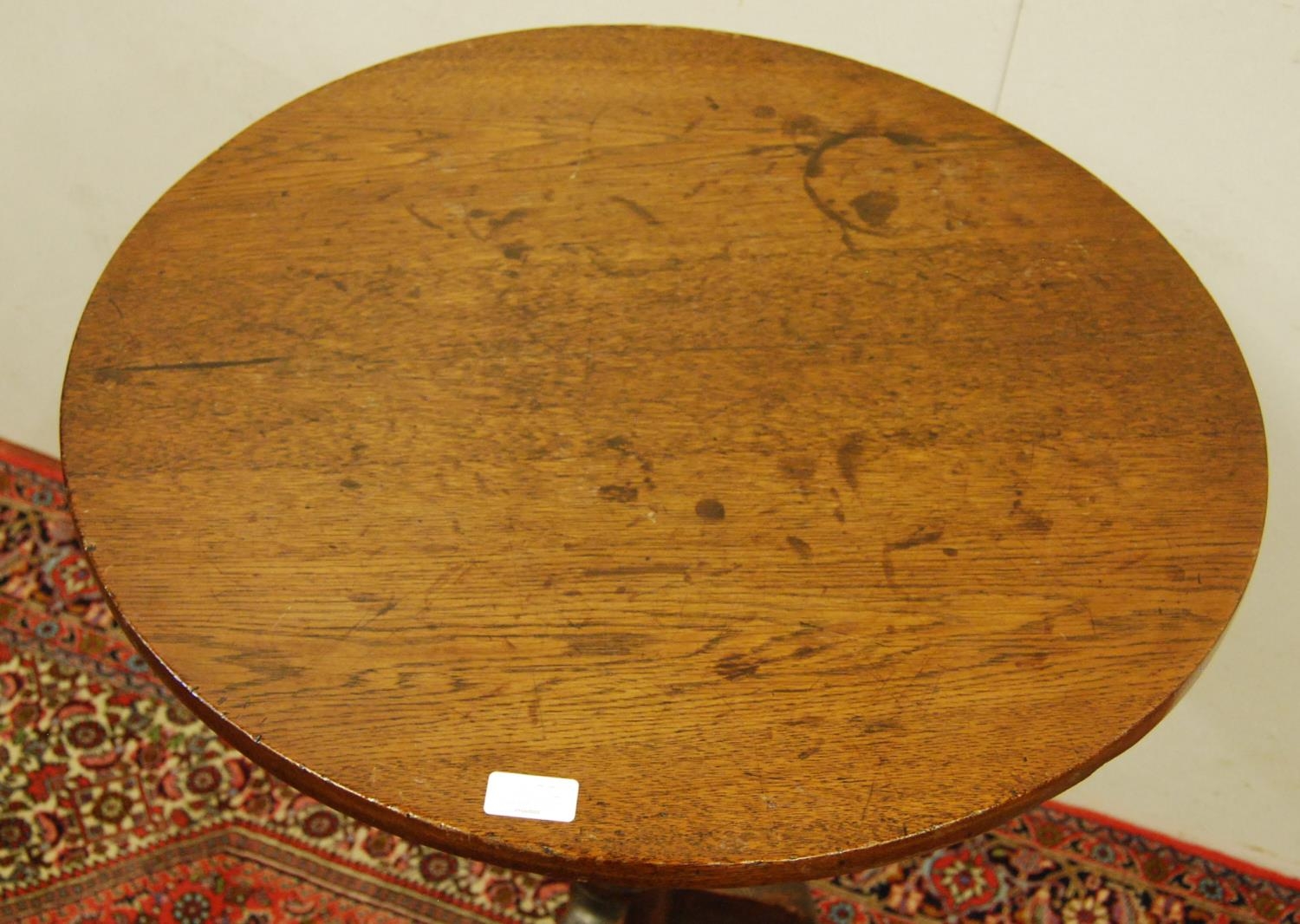 George III oak tripod table, the circular top on a turned column and tripod supports, 75cm high - Image 2 of 3