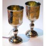 Near pair of Russian silver kiddush cups with engraved bands on moulded feet, Moscow c. 1910, 85g or