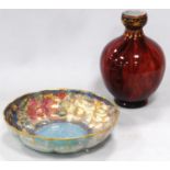 Royal Crown Derby lustre bowl with all over multi-coloured floral panels to the border, on a blue