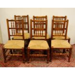 Set of six matching Lancashire-style ash and elm country chairs, with spindle decoration above woven