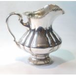 American silver water jug of lobed pear shape, inscribed and dated 1901, 24cm, 714g or 22oz.