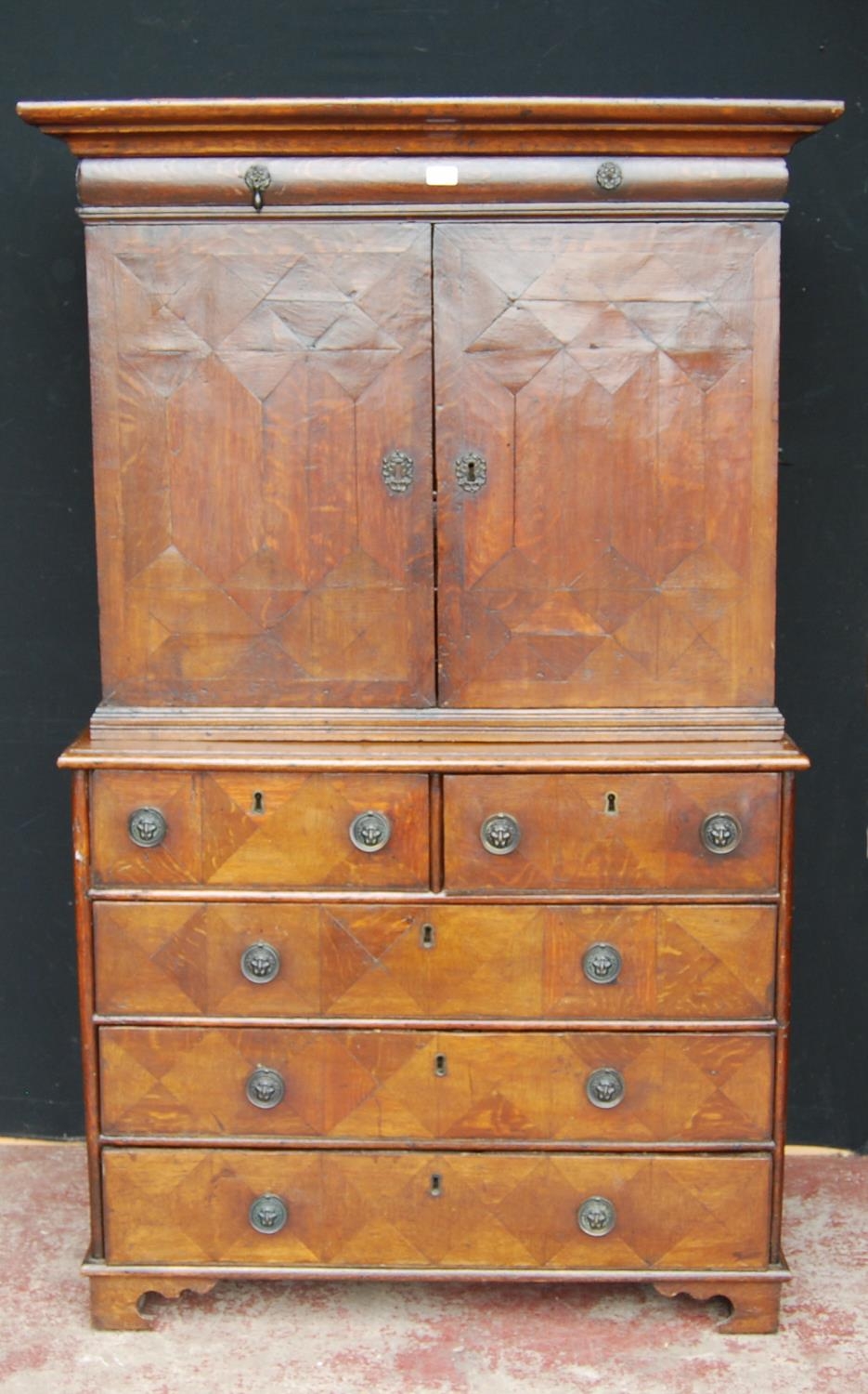 Early 18th century Queen Anne walnut cabinet on chest, the cabinet top with a long drawer above