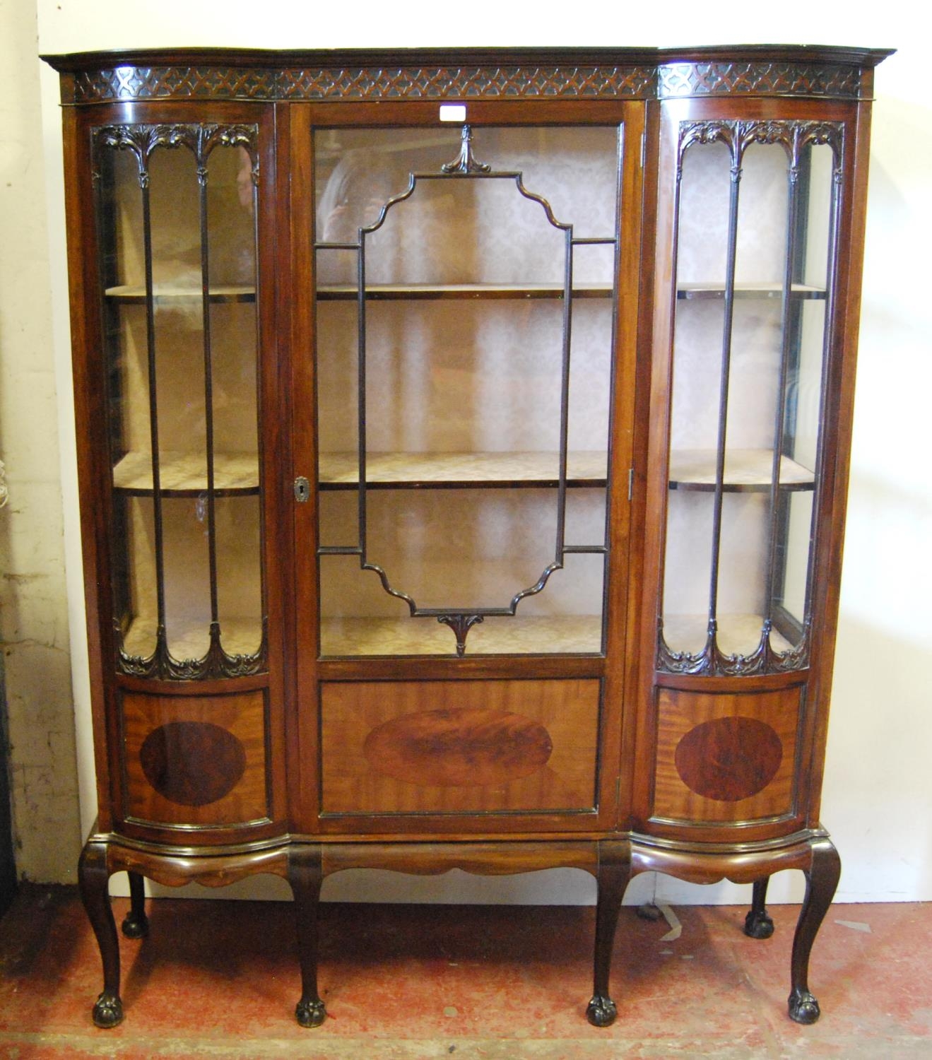 Art Nouveau mahogany display cabinet in the manner of Thomas Chippendale, the geometric frieze above