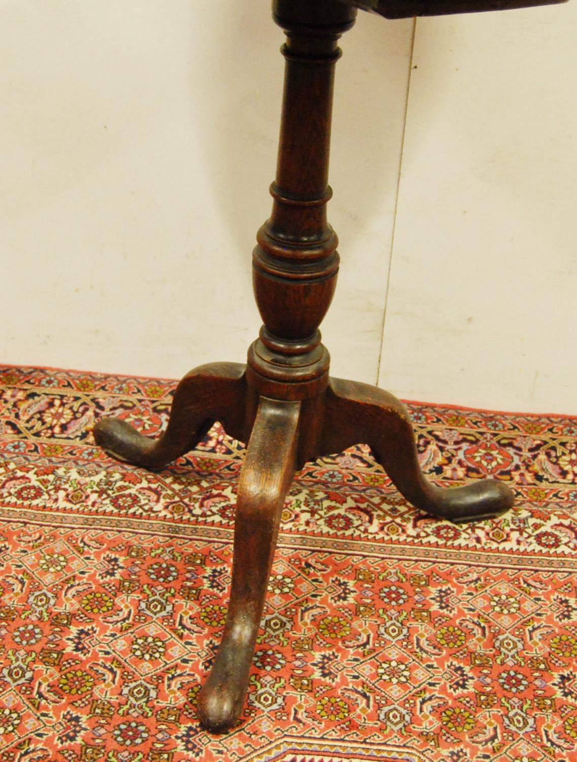 George III oak tripod table, the circular top on a turned column and tripod supports, 75cm high - Image 3 of 3