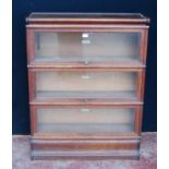 Globe Wernicke oak stacking bookcase, with three glazed sections, on base, with label to each