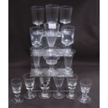 Collection of 18th century-style and similar antique drinking glasses to include ale glasses, on