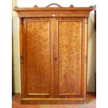 Victorian pitch pine wardrobe, the shaped cornice above two doors enclosing fitted drawers and