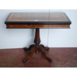 Victorian inlaid walnut and ebonised card table in the Aesthetic manner, the swivel fold-over top