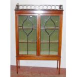 Edwardian inlaid mahogany display cabinet, with a concentric pierced pediment top above an inlaid