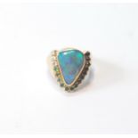 Gold dress ring of triangular form with doublet black opal and other gems, in 18ct gold, size R.