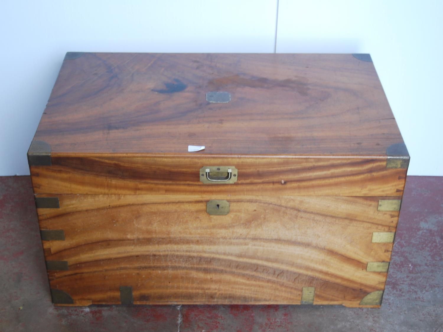 19th century brass-bound camphorwood blanket chest, the hinged top with brass handle, painted