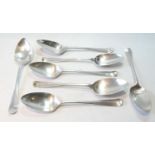 Seven silver tablespoons of Hanoverian pattern, crested, as a set, various dates and makers,